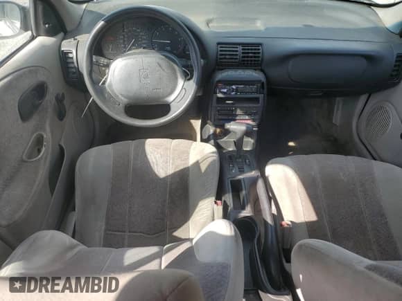 1997 Saturn SL с VIN 1G8ZK5274VZ271990, выставлен на аукционе Copart как лот 87279155 с пробегом 147 825 миль миль и Списание • Salvage title. История ставок и продаж доступна на DreamBid. Изображение 8.