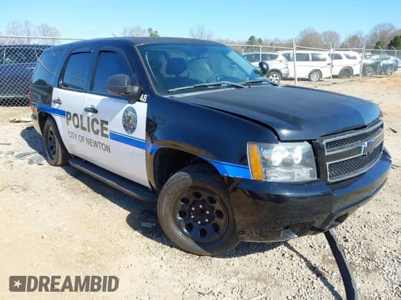 2014 Chevrolet Tahoe Commercial z VIN 1GNLC2E04ER158425, wystawiony jako IAAI lot #41526713 z przebiegiem Nie podano mil oraz . Historia ofert i sprzedaży dostępna na DreamBid. Obrazek 1.