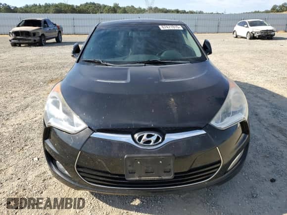 2013 Hyundai Veloster w/Black Int с VIN KMHTC6ADXDU159174, выставлен на аукционе Copart как лот 67471915 с пробегом 146 394 миль миль и Списание • Salvage title. История ставок и продаж доступна на DreamBid. Изображение 5.