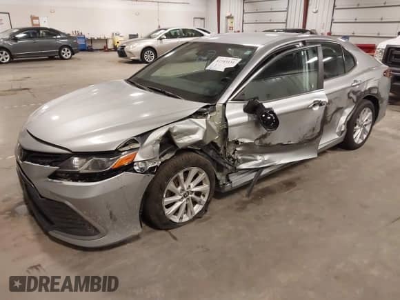 2022 Toyota Camry LE with VIN 4T1C11AK2NU052242, listed as a IAAI auction lot 42943151 with 213,562 mi miles and . Bid and sale history available at DreamBid. Image 2.