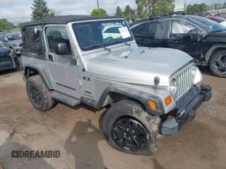 2003 Jeep Wrangler X z VIN 1J4FA39S73P313128, wystawiony jako IAAI lot #43301123 z przebiegiem 104 888 mil mil oraz . Historia ofert i sprzedaży dostępna na DreamBid. Obrazek 1.