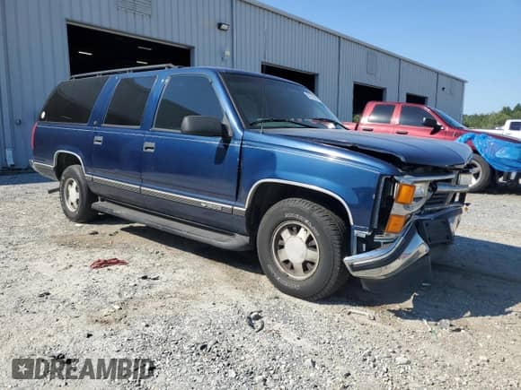 1999 Chevrolet Suburban with VIN 1GNEC16RXXJ381103, listed as a Copart auction lot 80702955 with 169,904 mi miles and Salvage title. Bid and sale history available at DreamBid. Image 4.