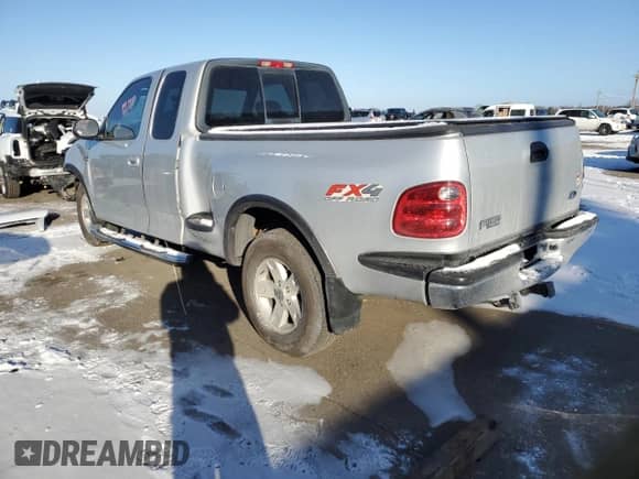 2003 Ford F-150 XL with VIN 2FTRX08L33CA22976, listed as a Copart auction lot 84183944 with 144,277 mi miles and Salvage title. Bid and sale history available at DreamBid. Image 2.