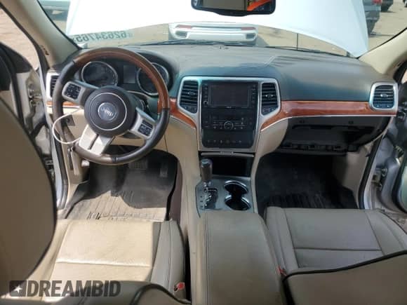 2011 Jeep Grand Cherokee Overland Summit with VIN 1J4RR6GTXBC536210, listed as a Copart auction lot 62634765 with 129,835 mi miles and Salvage title. Bid and sale history available at DreamBid. Image 8.