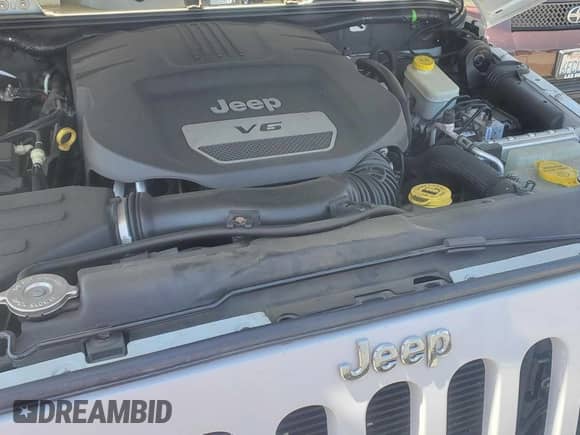 2014 Jeep Wrangler Sahara z VIN 1C4AJWBG3EL197444, wystawiony jako Copart lot #64733055 z przebiegiem 193 278 mil mil oraz Czysty tytuł • Clean title. Historia ofert i sprzedaży dostępna na DreamBid. Obrazek 7.