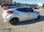 2013 Hyundai Veloster w/Black Int z VIN KMHTC6AD9DU136551, wystawiony jako Copart lot #83799205 z przebiegiem 101 623 mil mil oraz Szkoda całkowita • Salvage title. Historia ofert i sprzedaży dostępna na DreamBid. Obrazek 3.
