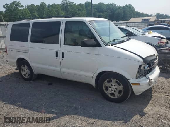 2005 Chevrolet Astro with VIN 1GNEL19X85B129609, listed as a Copart auction lot 60104065 with 153,465 mi miles and Salvage title. Bid and sale history available at DreamBid. Image 4.