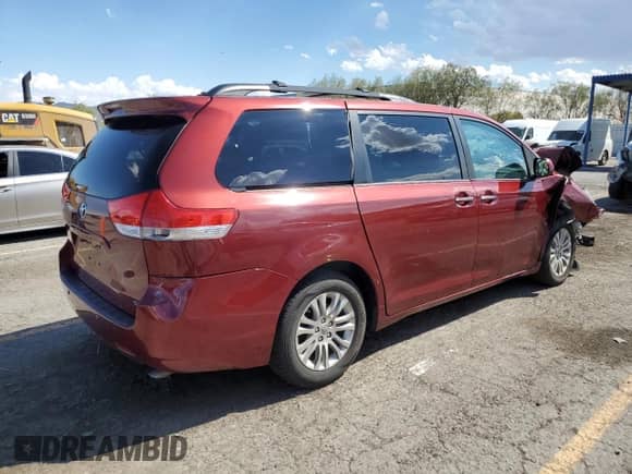2014 Toyota Sienna XLE with VIN 5TDYK3DC7ES472641, listed as a Copart auction lot 84237025 with 164,686 mi miles and Salvage title. Bid and sale history available at DreamBid. Image 3.