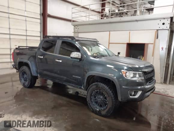 2018 Chevrolet Colorado 4WD LT z VIN 1GCGTCEN3J1150207, wystawiony jako IAAI lot #42887494 z przebiegiem 86 839 mil mil oraz . Historia ofert i sprzedaży dostępna na DreamBid. Obrazek 1.
