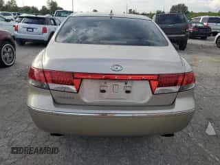 2009 Hyundai Azera GLS with VIN KMHFC46D09A360665, listed as a Copart auction lot 71665544 with 143,711 mi miles and Salvage title. Bid and sale history available at DreamBid. Image 6.