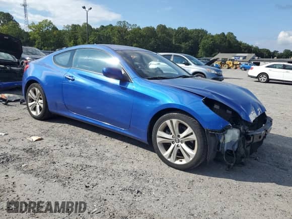 2010 Hyundai Genesis Coupe Track with VIN KMHHU6KH0AU015651, listed as a Copart auction lot 70811945 with 86,994 mi miles and Salvage title. Bid and sale history available at DreamBid. Image 4.