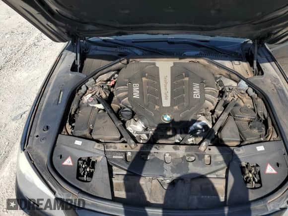 2012 BMW 7 Series 750i xDrive с VIN WBAKC6C50CC397154, выставлен на аукционе Copart как лот 66981905 с пробегом 162 379 миль миль и Списание • Salvage title. История ставок и продаж доступна на DreamBid. Изображение 11.