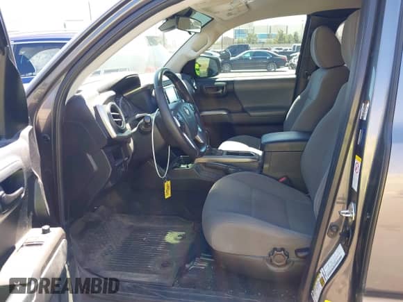 2018 Toyota Tacoma SR with VIN 5TFRX5GN1JX118441, listed as a IAAI auction lot 41870266 with 95,612 mi miles and . Bid and sale history available at DreamBid. Image 5.