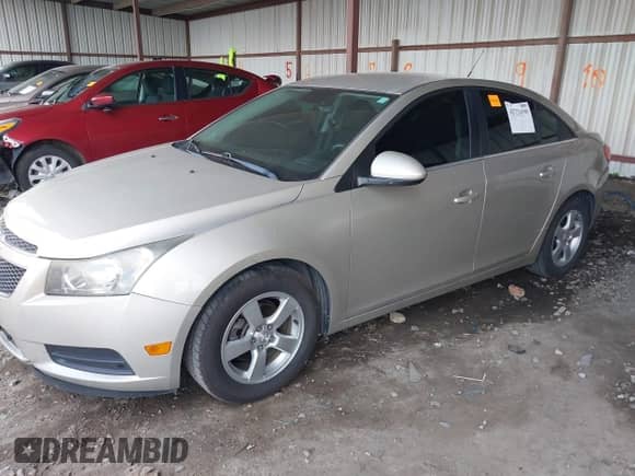 2014 Chevrolet Cruze LT with VIN 1G1PK5SB2E7374637, listed as a IAAI auction lot 42724596 with 120,344 mi miles and . Bid and sale history available at DreamBid. Image 2.