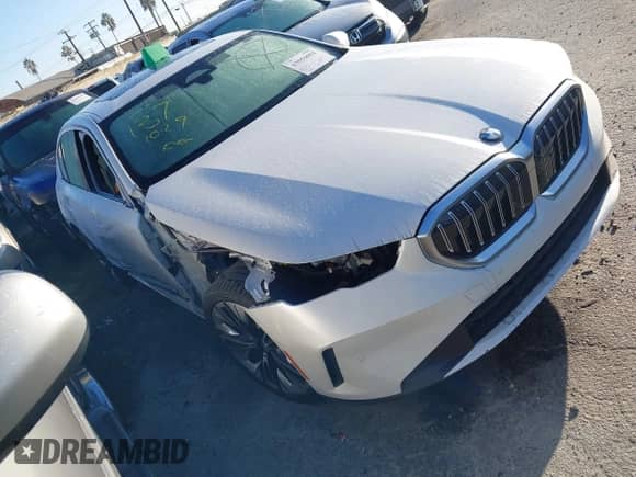 2024 BMW 5 Series 530i with VIN WBA43FJ06RCS61104, listed as a IAAI auction lot 43056084 with Not provided miles and . Bid and sale history available at DreamBid. Image 1.