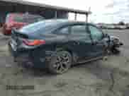 2024 BMW i4 xDrive40 with VIN WBY83FB09RFS54860, listed as a Copart auction lot 59111825 with 12,006 mi miles and Salvage title. Bid and sale history available at DreamBid. Image 3.