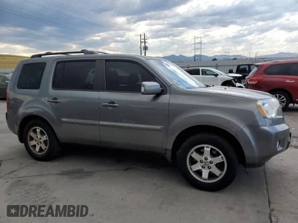 2009 Honda Pilot Touring with VIN 5FNYF48829B014693, listed as a Copart auction lot 65152355 with 160,961 mi miles and Salvage title. Bid and sale history available at DreamBid. Image 4.