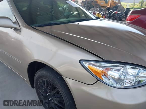 2004 Toyota Camry LE z VIN 4T1BE32K34U291565, wystawiony jako IAAI lot #42818319 z przebiegiem 59 993 mil mil oraz . Historia ofert i sprzedaży dostępna na DreamBid. Obrazek 14.