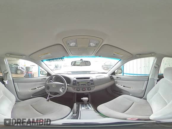 2004 Toyota Camry LE z VIN 4T1BF30KX4U569944, wystawiony jako Copart lot #81707915 z przebiegiem 246 068 mil mil oraz Szkoda całkowita • Salvage title. Historia ofert i sprzedaży dostępna na DreamBid. Obrazek 14.