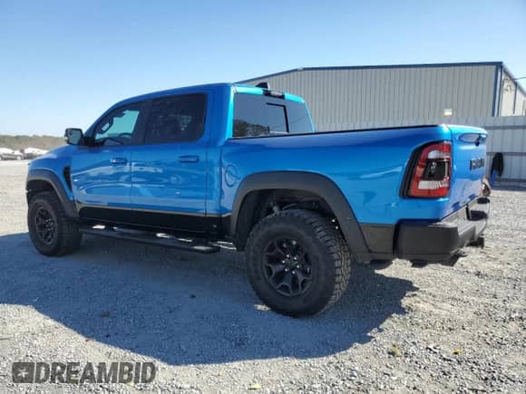 2022 Ram 1500 TRX with VIN 1C6SRFU93NN229879, listed as a Copart auction lot 77161374 with 7,836 mi miles and Salvage title. Bid and sale history available at DreamBid. Image 2.