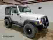 2001 Jeep Wrangler Sahara z VIN 1J4FA59S41P303519, wystawiony jako Copart lot #59899545 z przebiegiem 238 151 mil mil oraz Czysty tytuł • Clean title. Historia ofert i sprzedaży dostępna na DreamBid. Obrazek 4.