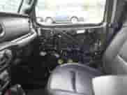 2023 Jeep Wrangler Sahara with VIN 1C4JJXP64PW684210, listed as a IAAI auction lot 42244388 with 23,622 mi miles and . Bid and sale history available at DreamBid. Image 19.