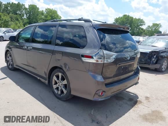 2014 Toyota Sienna SE with VIN 5TDXK3DC8ES443113, listed as a IAAI auction lot 42735795 with 235,269 mi miles and . Bid and sale history available at DreamBid. Image 3.
