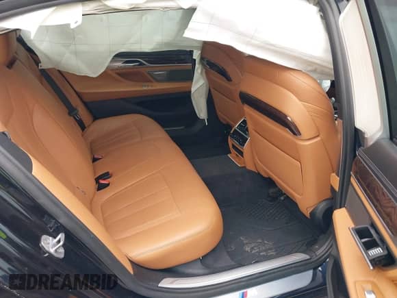 2019 BMW 7 Series 740i xDrive with VIN WBA7E4C54KGV28663, listed as a IAAI auction lot 42282060 with 73,109 mi miles and . Bid and sale history available at DreamBid. Image 8.
