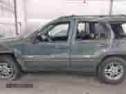 2003 Jeep Grand Cherokee Laredo z VIN 1J4GW48N53C557133, wystawiony jako IAAI lot #41047913 z przebiegiem 199 680 mil mil oraz . Historia ofert i sprzedaży dostępna na DreamBid. Obrazek 15.