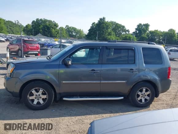 2010 Honda Pilot Touring with VIN 5FNYF4H88AB012001, listed as a IAAI auction lot 42635771 with 287,115 mi miles and . Bid and sale history available at DreamBid. Image 15.