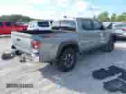 2021 Toyota Tacoma SR with VIN 3TYCZ5ANXMT024937, listed as a IAAI auction lot 43314888 with 77,580 mi miles and . Bid and sale history available at DreamBid. Image 4.