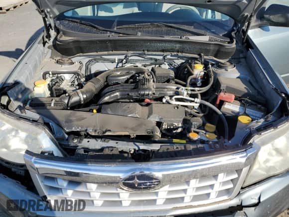 2012 Subaru Forester X z VIN JF2SHBBC4CH450018, wystawiony jako Copart lot #84604795 z przebiegiem 113 769 mil mil oraz Szkoda całkowita • Salvage title. Historia ofert i sprzedaży dostępna na DreamBid. Obrazek 12.