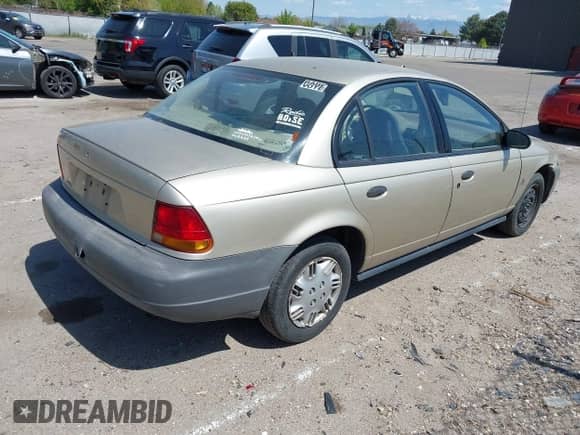 1996 Saturn SL z VIN 1G8ZH5288TZ230864, wystawiony jako IAAI lot #42116703 z przebiegiem 104 387 mil mil oraz . Historia ofert i sprzedaży dostępna na DreamBid. Obrazek 4.