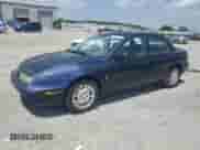 1999 Saturn SL z VIN 1G8ZK5274XZ200985, wystawiony jako Copart lot #61952535 z przebiegiem 145 391 mil mil oraz Szkoda całkowita • Salvage title. Historia ofert i sprzedaży dostępna na DreamBid. Obrazek 1.