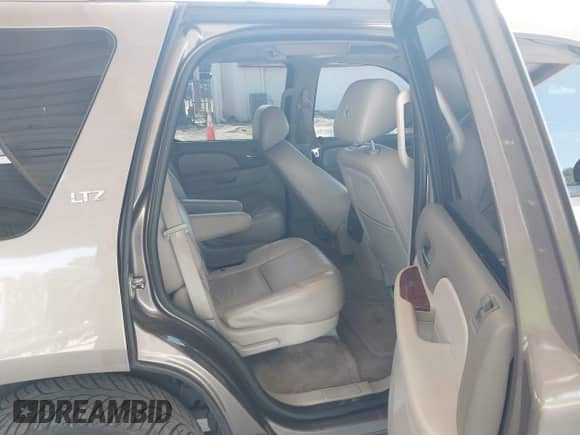 2011 Chevrolet Tahoe LTZ with VIN 1GNSCCE09BR333023, listed as a IAAI auction lot 43085215 with 165,616 mi miles and . Bid and sale history available at DreamBid. Image 8.