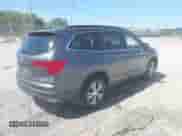 2018 Honda Pilot EX-L with VIN 5FNYF5H50JB006656, listed as a IAAI auction lot 43179982 with 130,515 mi miles and . Bid and sale history available at DreamBid. Image 4.