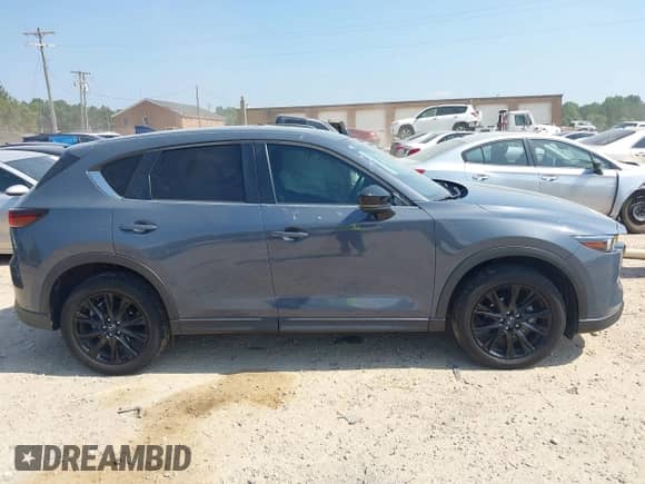 2022 Mazda CX-5 S Preferred z VIN JM3KFBCMXN1534309, wystawiony jako IAAI lot #42600606 z przebiegiem 40 529 mil mil oraz . Historia ofert i sprzedaży dostępna na DreamBid. Obrazek 13.