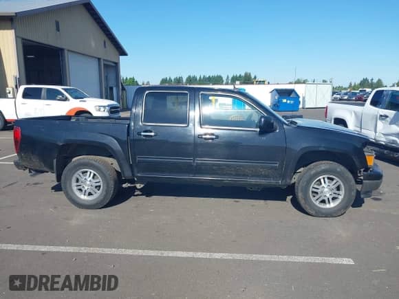 2011 Chevrolet Colorado 1LT z VIN 1GCHTCFE2B8115945, wystawiony jako IAAI lot #42314389 z przebiegiem 250 571 mil mil oraz . Historia ofert i sprzedaży dostępna na DreamBid. Obrazek 14.