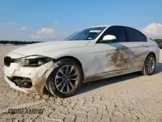 2018 BMW 3 Series 320i with VIN WBA8A9C52JAH12453, listed as a Copart auction lot 80761055 with 154,776 mi miles and Salvage title. Bid and sale history available at DreamBid. Image 1.