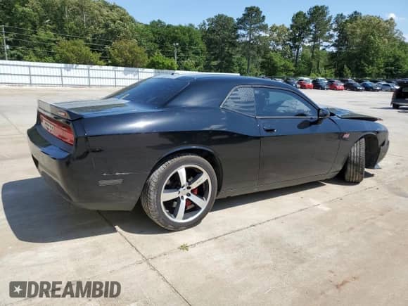 2012 Dodge Challenger SRT-8 392 с VIN 2C3CDYCJ4CH160486, выставлен на аукционе Copart как лот 58217515 с пробегом 149 085 миль миль и Списание • Salvage title. История ставок и продаж доступна на DreamBid. Изображение 3.