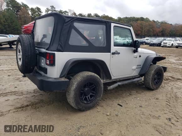 2012 Jeep Wrangler Sport with VIN 1C4AJWAG2CL117209, listed as a Copart auction lot 90579055 with 48,119 mi miles and Clean title. Bid and sale history available at DreamBid. Image 3.