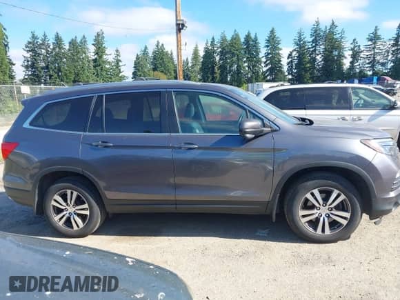 2016 Honda Pilot EX-L with VIN 5FNYF6H61GB091014, listed as a IAAI auction lot 42732857 with 172,125 mi miles and . Bid and sale history available at DreamBid. Image 13.