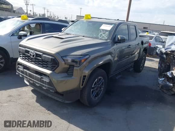 2024 Toyota Tacoma SR5 with VIN 3TMLB5JN1RM043397, listed as a IAAI auction lot 42181997 with 9,254 mi miles and . Bid and sale history available at DreamBid. Image 2.