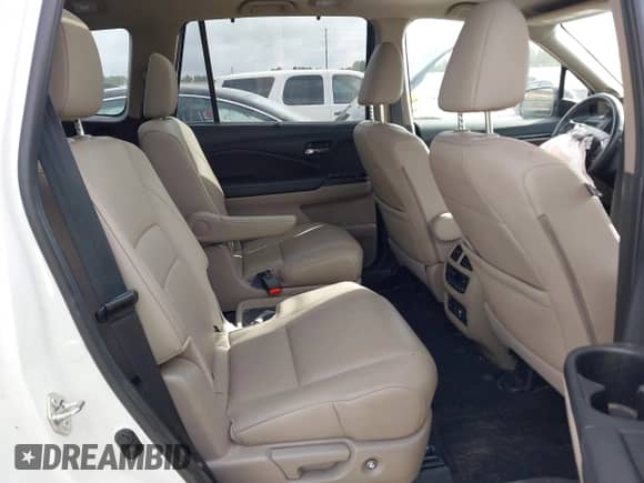 2021 Honda Pilot Elite with VIN 5FNYF6H04MB079091, listed as a IAAI auction lot 42739979 with 62,723 mi miles and . Bid and sale history available at DreamBid. Image 8.