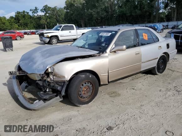 1995 Toyota Camry DX z VIN 4T1SK11E6SU553990, wystawiony jako Copart lot #68037885 z przebiegiem 195 488 mil mil oraz Szkoda całkowita • Salvage title. Historia ofert i sprzedaży dostępna na DreamBid. Obrazek 1.