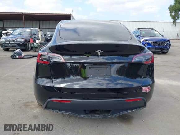 2024 Tesla Model Y with VIN 7SAYGDED8RF156984, listed as a IAAI auction lot 43324819 with 26,941 mi miles and . Bid and sale history available at DreamBid. Image 16.