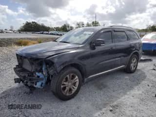 2012 Dodge Durango Crew with VIN 1C4RDHDG9CC108797, listed as a Copart auction lot 85138195 with 215,948 mi miles and Salvage title. Bid and sale history available at DreamBid. Image 1.