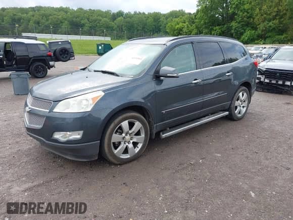 2009 Chevrolet Traverse LTZ with VIN 1GNER33DX9S124927, listed as a IAAI auction lot 42192814 with 185,302 mi miles and . Bid and sale history available at DreamBid. Image 2.