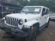 2022 Jeep Wrangler Unlimited Sahara Altitude with VIN 1C4HJXEG9NW232468, listed as a IAAI auction lot 42667697 with 40,881 mi miles and . Bid and sale history available at DreamBid. Image 2.