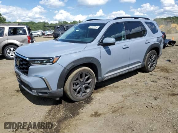 2023 Honda Pilot Elite with VIN 5FNYG1H82PB034130, listed as a Copart auction lot 56763214 with 7,710 mi miles and Salvage title. Bid and sale history available at DreamBid. Image 1.